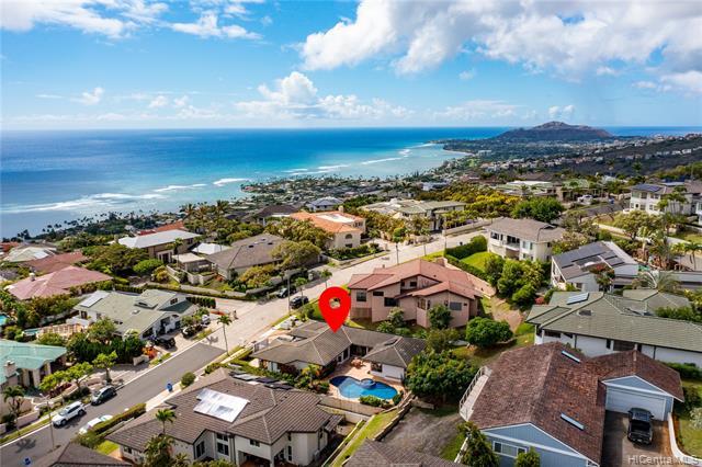 Experience spectacular ocean and mountain views from this tastefully renovated and beautifully maintained 3 bdrm/2.5 bath home in the highly coveted gated community, Hawaii Loa Ridge. Newly updated in 2022, this primarily single level home is located on a 9,173 sq ft lot and features remodeled kitchen and baths, new flooring, an owned PV system with net metering agreement, and beautifully landscaped outdoor space with a generous in-ground swimming pool and spa. Conveniently located near beaches, parks, shopping, and entertainment. A must see!