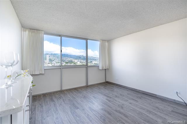 MOVE IN READY! BEAUTIFULLY renovated 1bed/1bath/1 covered parking unit in PRIME WAIKIKI! 180 degree GORGEOUS mountain and canal views can be seen from this FABULOUS home. NEW paint, NEW FLOORS, NEW kitchen, NEW bath, NEW appliances, REGLAZED TUB, tankless water heater. Individual secure storage space outside of unit. Galore of amenities: Saltwater swimming pool, sunbathing deck, sauna, BBQ area, fitness room, gated parking, bicycle & surfboard storage & community laundry. $604.35/mo fee includes ($520.14 maintenance fee+ $51.46 parking fee + $32.75 cable fee)