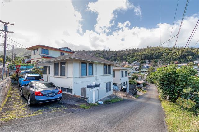 NEW LISTING! Don’t miss this great opportunity to own 2 detached buildings, centrally located in Kalihi Valley.  Front building consists of a 2 bdrm/1 bath on the top level and a 2 bdrm/1 bath on the bottom level. Second building is a 1 bdrm/1 bath upstairs and a 1 bdrm/bath downstairs.  Conveniently located near Downtown Honolulu, schools and restaurants! Tenant occupied, do not enter property without an appointment.  Improvements do not match tax office records.