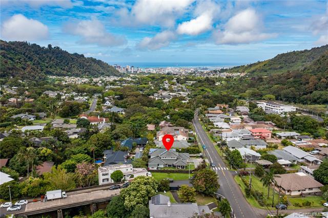 NEW LISTING!! Enjoy island living at its finest offered by this impeccably maintained 4 bdrm/3 bath PLUS large den executive style residence with dramatic mountain views in highly desirable Nuuanu/Pali neighborhood. Situated on an over 10,000 sq. ft. CORNER LEVEL lot, the home offers over 3,600 sq. ft. of tastefully finished interior living space with fresh exterior paint, new carpet, an open floor plan with a beautifully remodeled kitchen and 35 owned PV panels w/ net metering agreement! Large French doors lead you to the beautifully landscaped yard and an expansive covered lanai with a fire pit, perfect for indoor/outdoor entertaining! Enjoy a BONUS finished shed with its own deck that can be set up as your private office, art studio or m