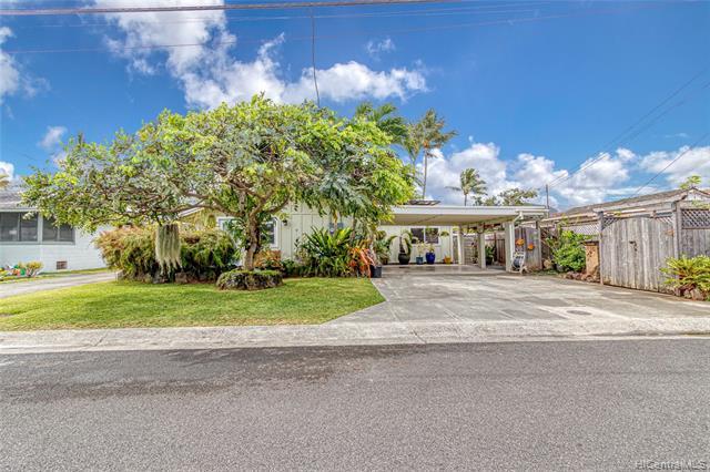 Fantastic street appeal on this great Kailua double-wall single level home w/ 4 bdrms 2 newly renovated bathrms & a bonus half bath/laundry room.  PLUS an attached 1/1 (with its own laundry) – currently configured as a hair salon + studio.  This home has been lovingly renovated through the years with new LVP laminate flooring, fresh paint, plantation shutters, breezeway windows, french doors, new ceiling fans, lighting and much, much more.  Nice entry foyer that goes to each unit…. Excellent home office option, in-law suite or other.  Very nicely landscaped w/lots of unique plants & a fruit bearing Kalamansi tree!  Attached carport & lots of storage throughout…  Great lanai off the back yard for the Tiki bar experience (with bathroom!)  Upg