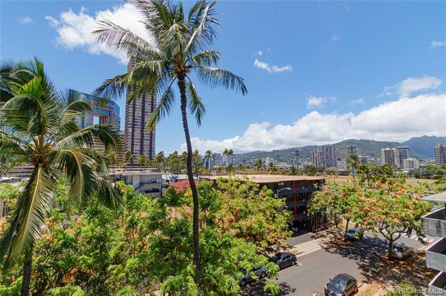 This charming condo on a lovely tree lined street awaits you in Waikiki.  Open floor plan, scenic mountain, tree top, city views and rooftop pool for you and your guests to enjoy. 2 bedrooms, 2 fully remodeled baths, luxury vinyl floors throughout, 2 entrances, 1 parking, washer and dryer in the unit and storage locker for your convenience. Secure building, two blocks to Waikiki Beach, world class shopping and dining.