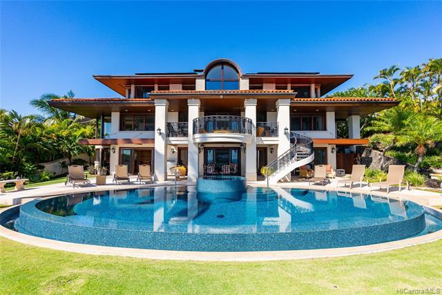 Brokers Open Only Wed, 8/3/22 9:30am-11:30pm.  View, View, View! Discover this exquisite estate in Oahu’s secure, gated community of Hawaii Loa Ridge. Designed to maximize ocean views, this island oasis boasts panoramic ocean views of Oahu’s southern shoreline from Koko Head to Diamond Head. Remodeled in 2019, the open floorplan features a chef kitchen w/ new high-end stainless steel appliances, gas cooktop, quartz kitchen countertops, Italian travertine tile and refinished hardwood and tile floors throughout the home. Updated amenities include retiled bathrooms, new air conditioning units, and a new heated infinity saltwater infinity edge pool and spa to enjoy the panoramic views.  Contemporary and elegant with multiple areas for entertain