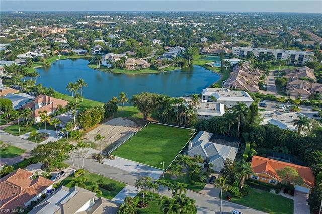 Located in desirable Park Shore on one of the last remaining lake view lots, built by Lexa Homes and