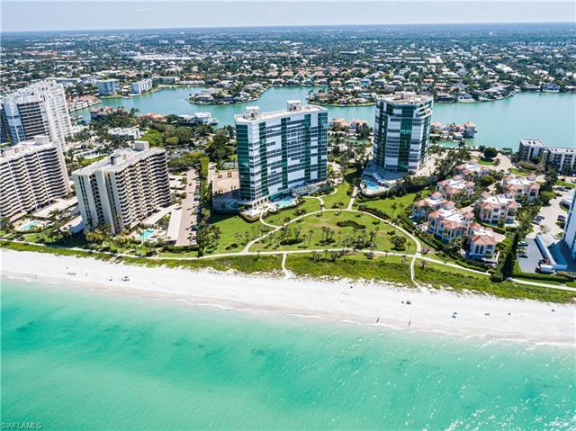 Panoramic views of the Gulf of Mexico await you - probably not for long! - at this spacious end unit