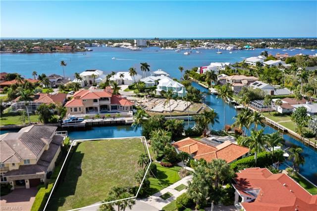 One of Naples most sought after waterfront communities, Royal Harbor! This spectacular parcel is as 