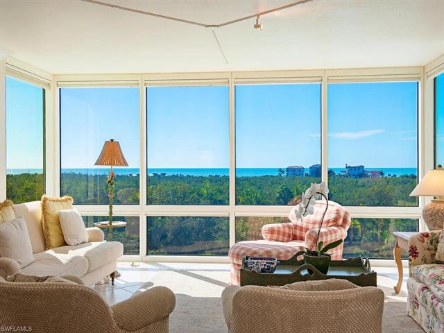 Never miss a sunset from this exquisite residence in the esteemed Claridge Condominium in Pelican Ba