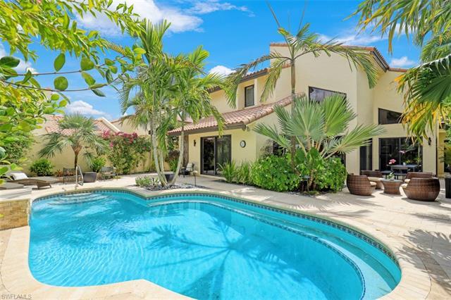 V7226 - Tucked in its own tropical oasis w/in the prestigious Pelican Bay neighborhood is a home tha