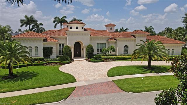 Majestic lakefront estate in Quail West with a TRANSFERABLE GOLF MEMBERSHIP & new furnishings is a s