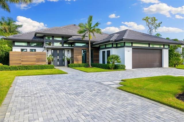 This Legacy Estates model home is the jewel of North Naples.  This gorgeous single family home has 3