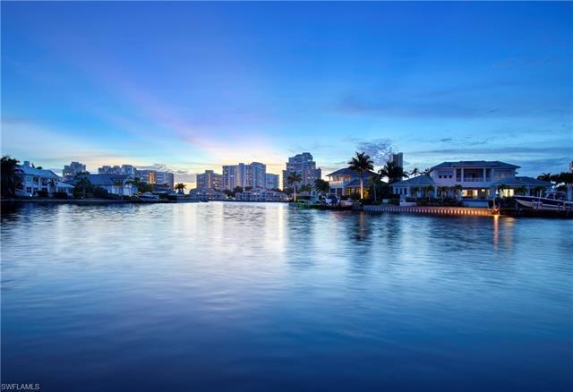 Delight in panoramic water views from numerous vantage points in this move in ready Park Shore home.