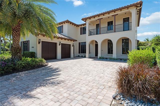 Extraordinary resort style home in Grey Oaks. This exquisite home sits perfectly on a cul-de-sac sho