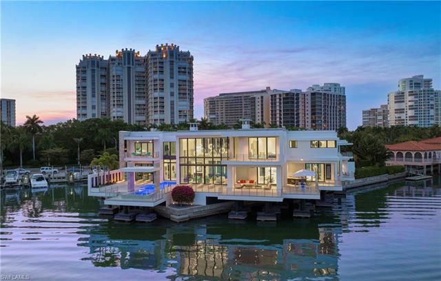 The jewel of Park Shore, this contemporary masterpiece hovers over the Venetian Bay like a diamond, 