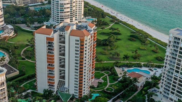 This stunning 2 bedroom + den beachfront condo in the coveted Park Shore - Venetian Village Area off