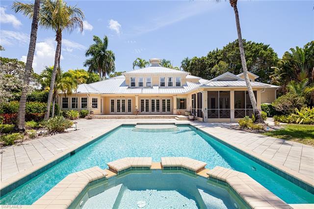 The ultimate Naples lifestyle with land and privacy within 1.6 miles of Seagate Beach access to the 