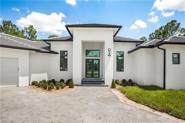 The finest constructed home you will find in Golden Gate Estates. This spectacular masterpiece featu