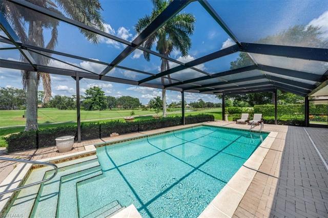 Soaring possibilities in this golf & lake front pool home.  Natural wood beams on the vaulted ceilin