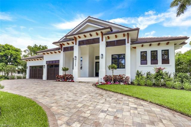 This new construction home in the coveted Moorings neighborhood was just completed in May 2022! The 