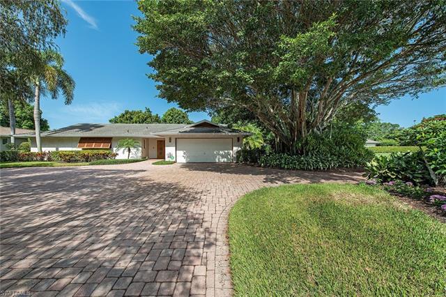 Enjoy this oversized corner lot in the Moorings at the intersection of Regatta Road and Riviera Driv