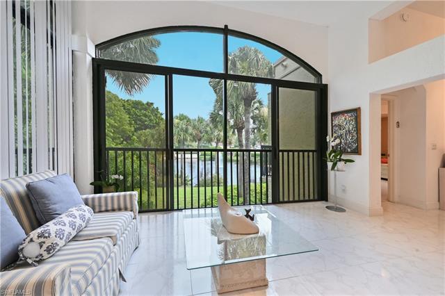 This RARELY AVAILABLE Coach Home is in one of the most sought-after communities in Pelican Bay. Perf