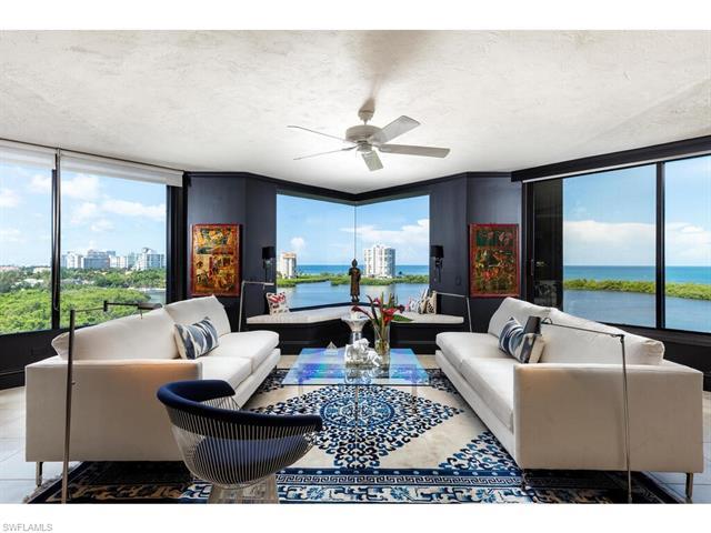 C6454 Sweeping Gulf, bay and city views make this unique Heron 901 condo in Pelican Bay a desired re