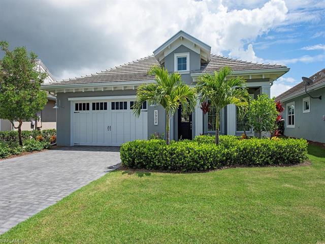 Welcome to this beautiful single family home in the gated community of The Isles of Collier Preserve