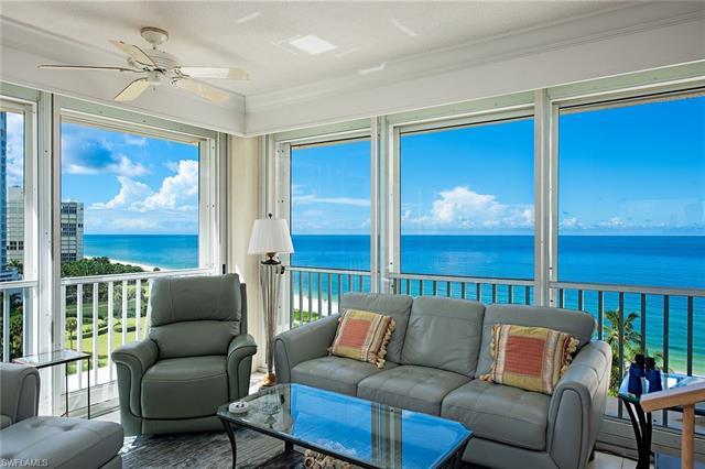 Enjoy 180 degree Views of the Beach, Sparkling Venetian Bay and one of Park Shore's beautifully land