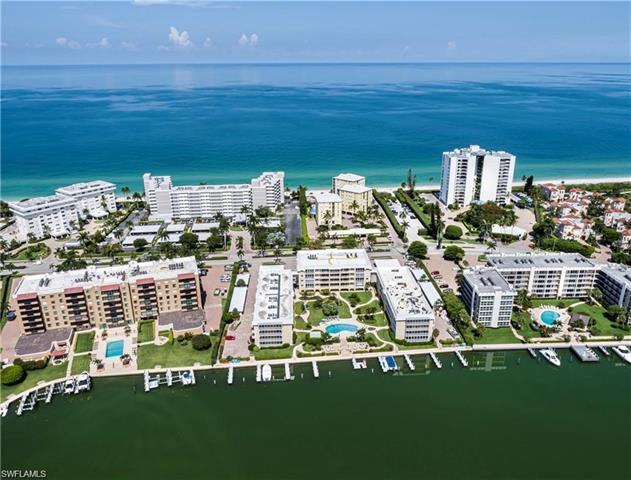 Welcome to this 2nd floor, HUGE BAY view condo, with GULF views from screened lanai and bedroom balc