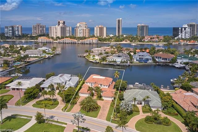 Delight in panoramic water views from numerous vantage points in this move in ready Park Shore home.
