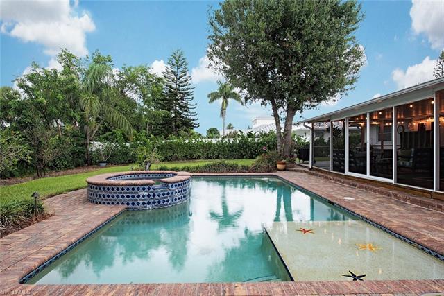 H12135. In The Moorings, this charming one-story residence, built in 1967 and updated over time, sit