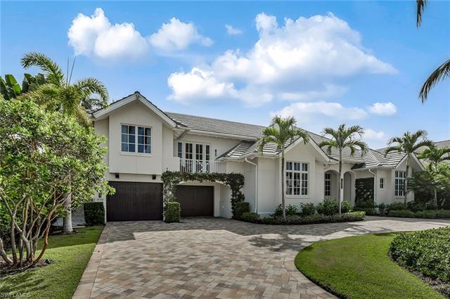 Stunning resort-style waterfront home situated on one of the widest canals in sought-after Aqualane 