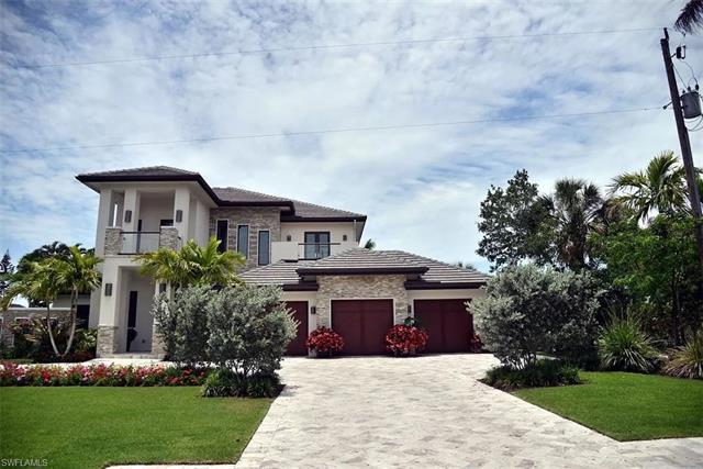 This beautiful home with panoramic golf course views has a master suite/bath and an office on main l