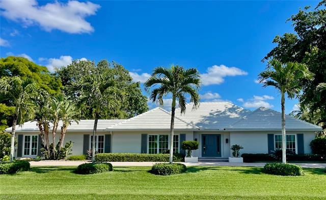 An elegant & expansive newly updated Moorings home with over 3300 square feet of living area located