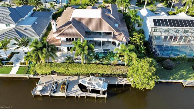 Introducing an extraordinary custom-built home in Southern Exposure Aqualane Shores: a 5,800 sq ft r