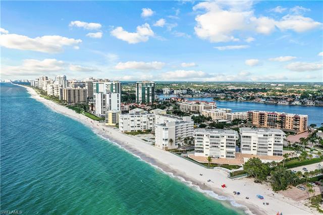 Welcome to Regency Towers!  Situated directly on Naples beach this 3rd floor end unit offers endless