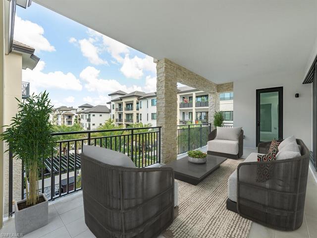 Welcome to Quattro at Naples Square in the Heart of Downtown Naples! Move-In Ready, this new constru