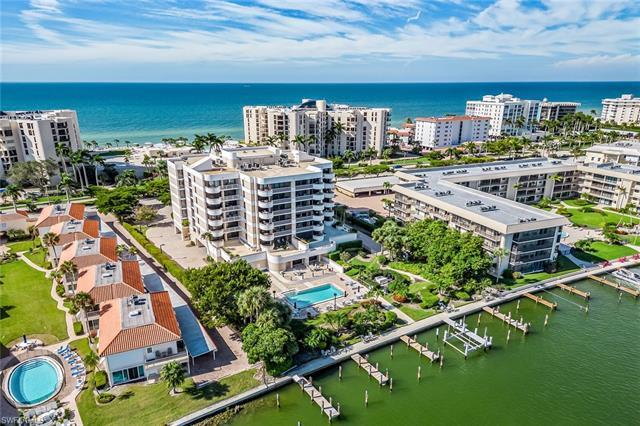 Experience breathtaking views of Moorings Bay from virtually every room in this expansive three-bedr