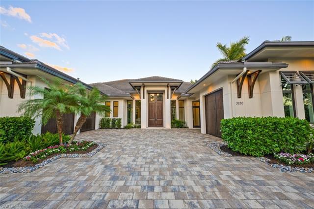 Exquisite residence is now available in the sought after community of the Moorings. This spectacular