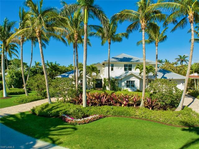 H8740-Stunning home situated in the heart of Moorings on a quiet street is an unsurpassed & prominen
