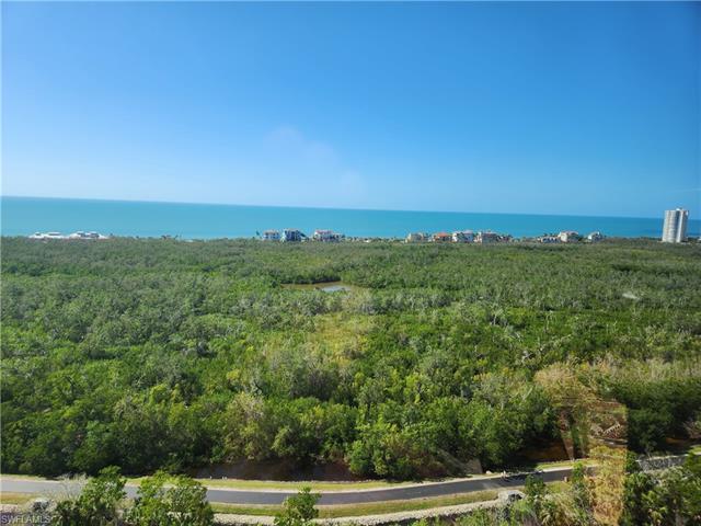 Expansive Gulf of Mexico and Club at Pelican Bay golf course views from this meticulously maintained