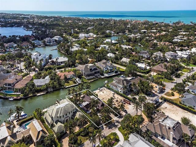 Amidst some of Naples' most exquisite and elegant waterfront homes sits a rare home site offering th