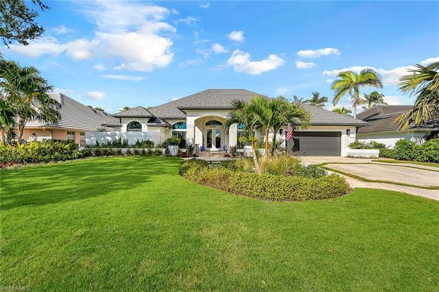 Your serene, idyllic dream home in the heart of Pelican Bay awaits you! You will fall in love with e