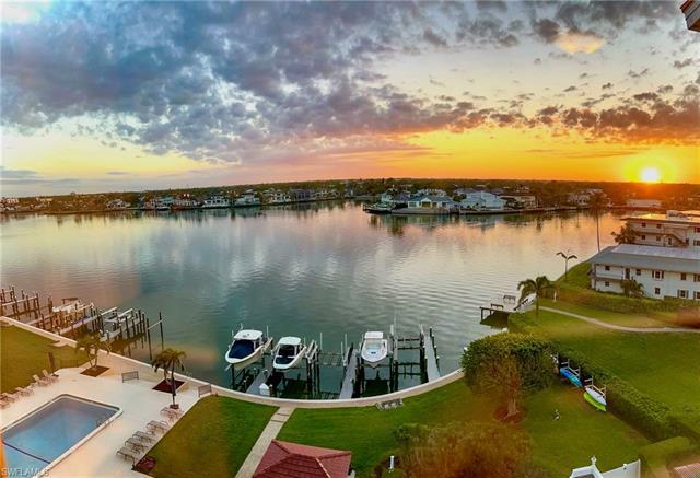 Enjoy gorgeous views of Venetian Bay and the Gulf of Mexico from this top floor residence at the Mad
