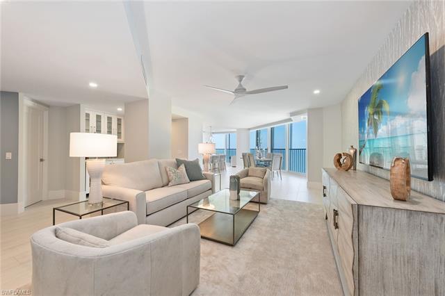 Enjoy stunning Naples sunsets from this completely designer-remodeled, 18th-floor residence with dir