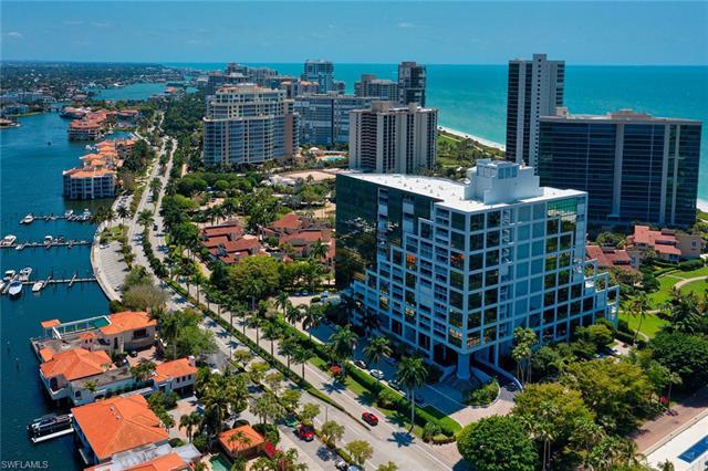 This is it!! Views, views, and walls of glass overlooking both the Gulf and Bay from this 2 bedroom,