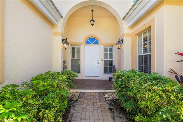Rarely available  Carlton Place villa  in Pelican Bay showcases a well laid out for floor plan that 