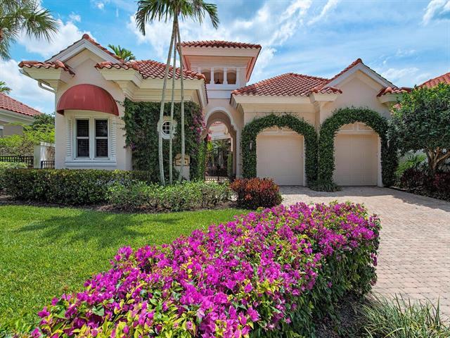 Indulge in luxury living in this elegant courtyard residence located in the prestigious Isle Verde a
