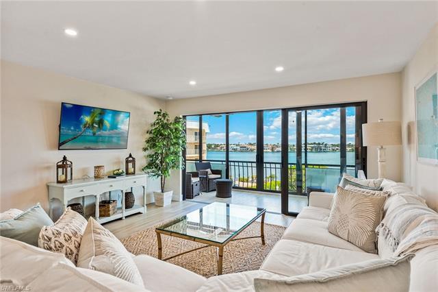 This completely renovated three-bedroom end-unit has incredible third floor Moorings Bay views from 