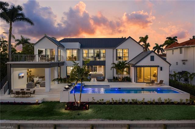 This newly built waterfront home by Oakley Home Builders with direct Gulf access & smart home automa