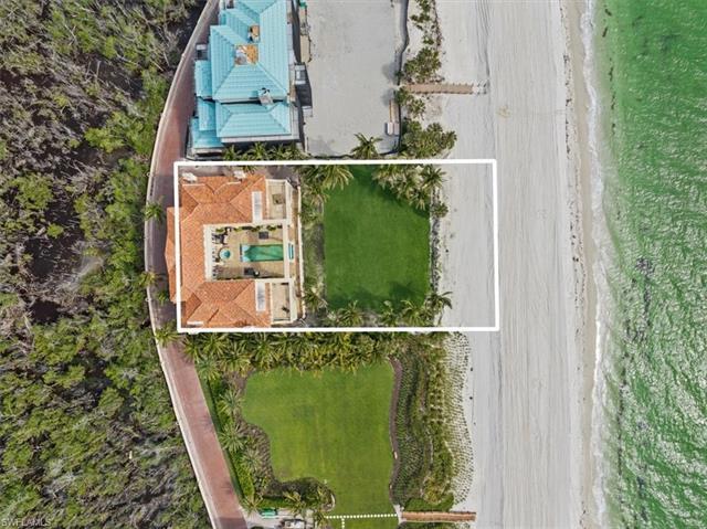 An exceptionally rare opportunity awaits the discerning buyer seeking a beachfront paradise in Naple